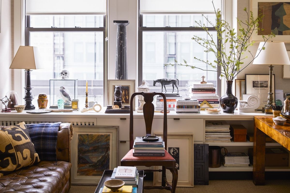 A curated study with books and collected objects